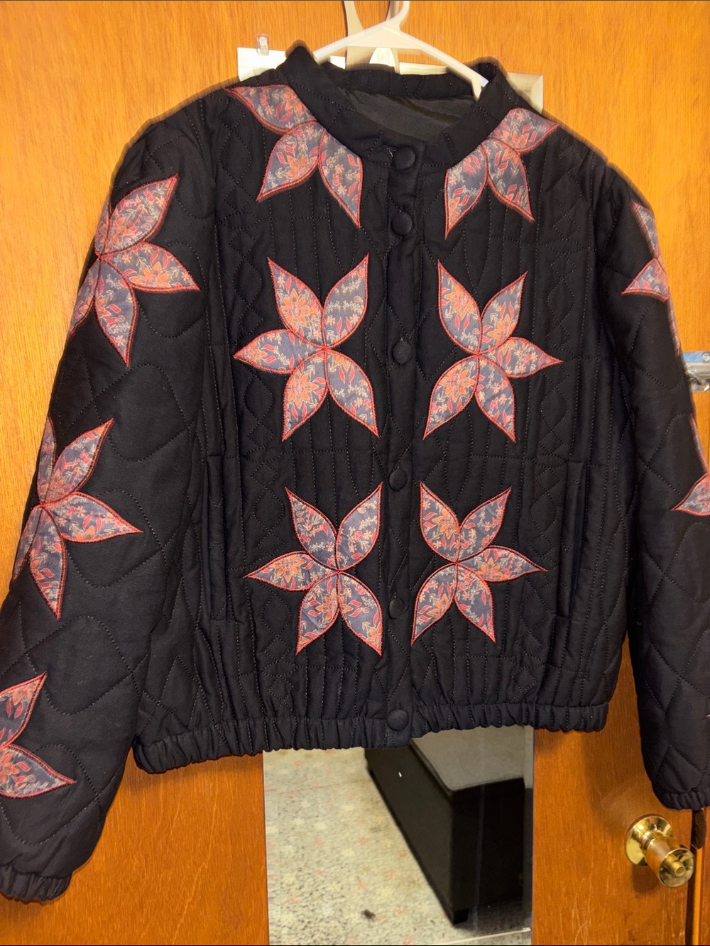 Amazon Black Quilted Jacket with Red and Blue Floral Stars